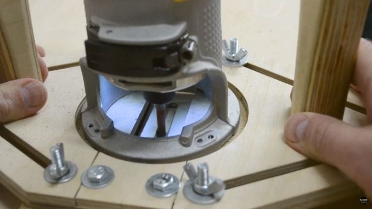 Routing slots in the hold-down base and vertical arm with a multipurpose router jig.