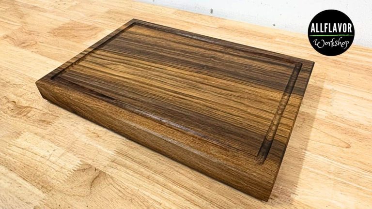 Walnut cutting board for beginners with juice groove, side handles, and rubber feet (simple face grain build).