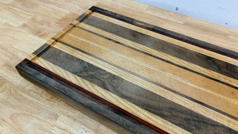 Dry, dull cutting board surface showing faded color before oiling and waxing.