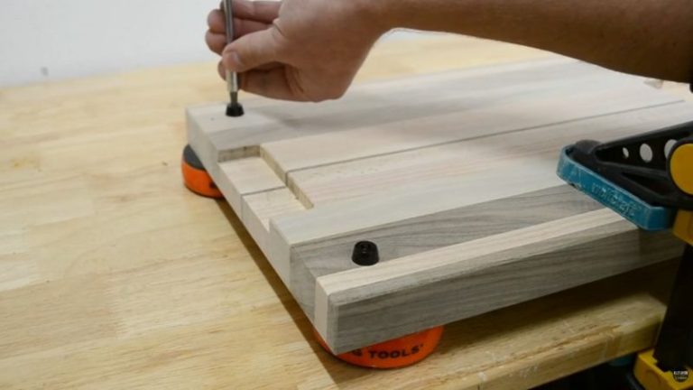 Underside of a cutting board with rubber feet installed, clean and raised off the surface.