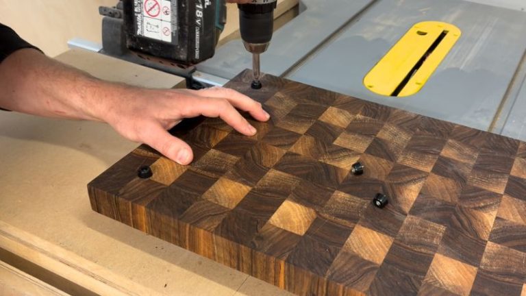 Installing rubber feet on a cutting board using M2 x 11 screws.