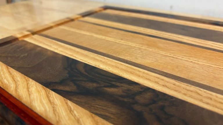 Refinished edge grain cutting board after restoration, showing a smooth surface, clean juice groove, and refreshed color.