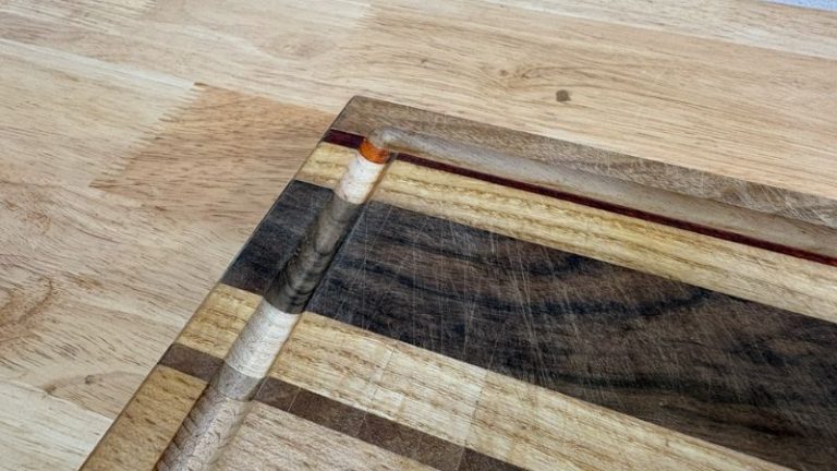 Freshly rerouted juice groove on a cutting board showing clean, straight edges after refinishing.