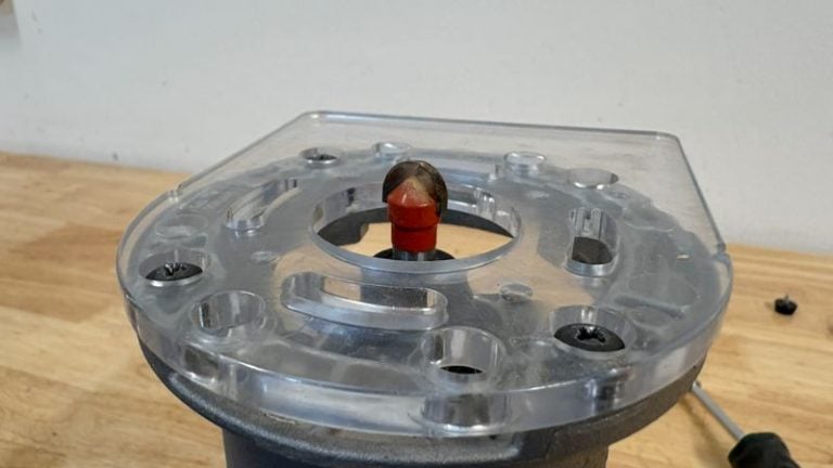 Juice groove router bit installed in a trim router for recutting a cutting board groove.