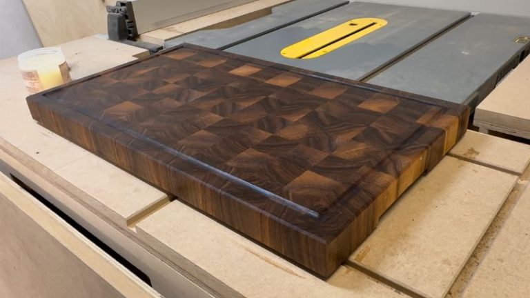 Cutting board after applying finish, showing richer wood color and stronger contrast after oil and wax.