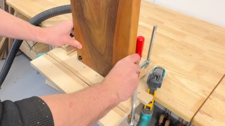 Routing a side finger groove (side slot) handle in a cutting board using a round nose bit on a router table with light passes.