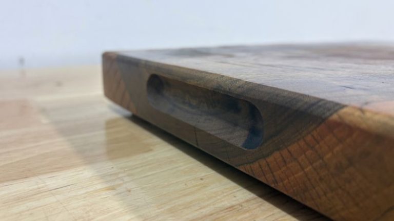 Side finger groove (side slot) handle on a cutting board routed into the side using a round nose bit for an easy grip.