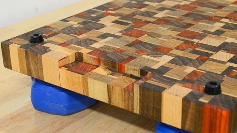 Bottom view of an underside finger grip handle routed into a cutting board using a straight bit.