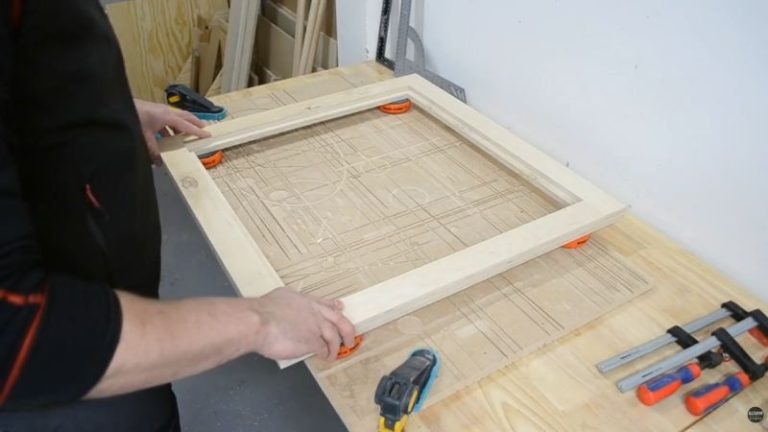 Dry-fitting one of the plywood support frames and checking it for squareness.