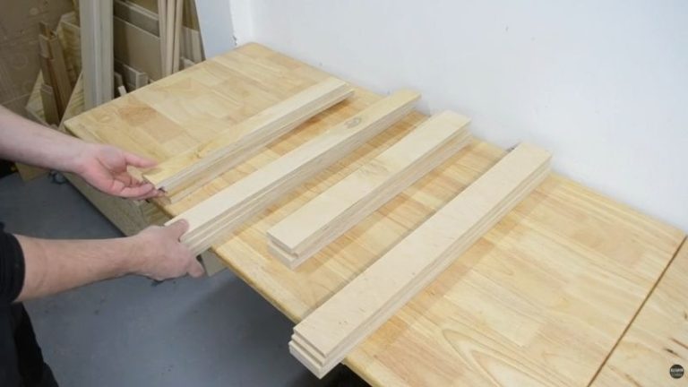 Identical plywood frame pieces prepared in pairs for lamination on a rolling planer stand build.
