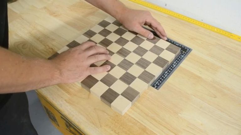 Flattened chessboard panel after planing, with a smooth level surface ready for trimming and final sanding.