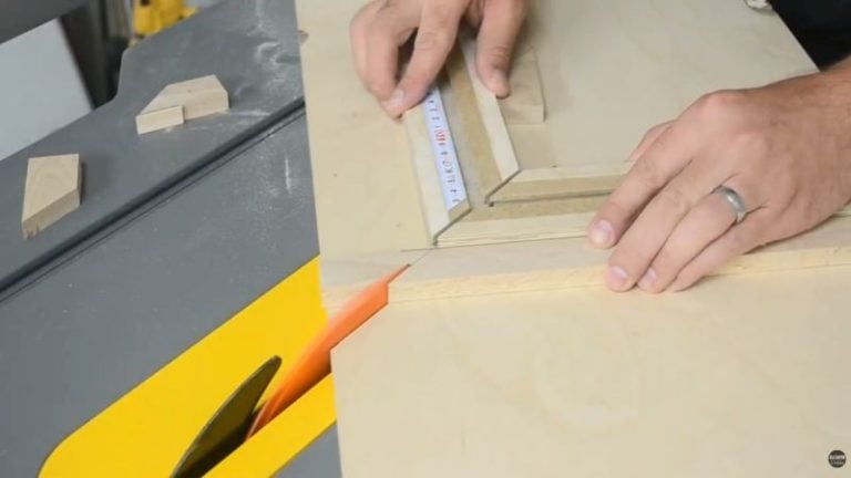 Marking and cutting miter joints for a chessboard frame using a table saw picture frame jig for accurate corners.
