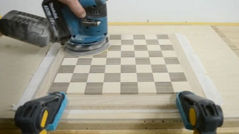 Quick water spray to raise the grain — then a light sanding pass once it dries.