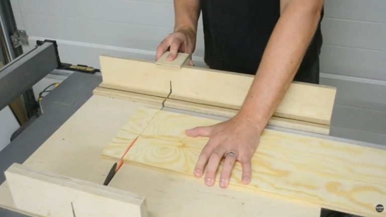 Crosscutting two uniform support strips on a table saw for the back bottom and back top supports of a DIY lumber storage cart.
