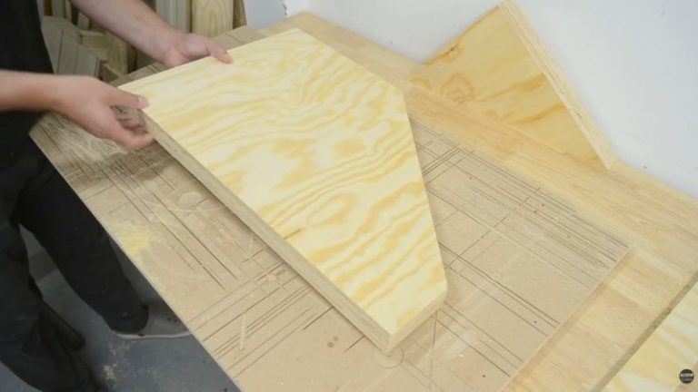 Cutting inner dividers for a DIY lumber storage cart on a table saw and making an angled cut with a circular saw straight edge guide.