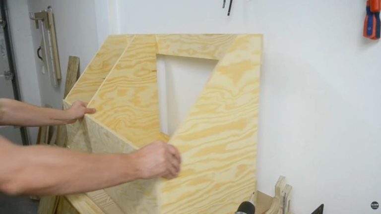 DIY lumber storage cart case assembled with front panel installed, showing a rigid frame ready for internal boxes and casters.