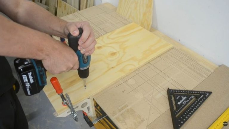 Clamp first so the panel can’t shift — then predrill and screw it down.