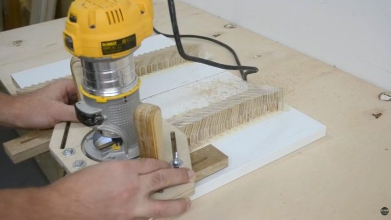 Flattening the glued plywood herringbone panels using a multi-function router jig before laminating the handle.