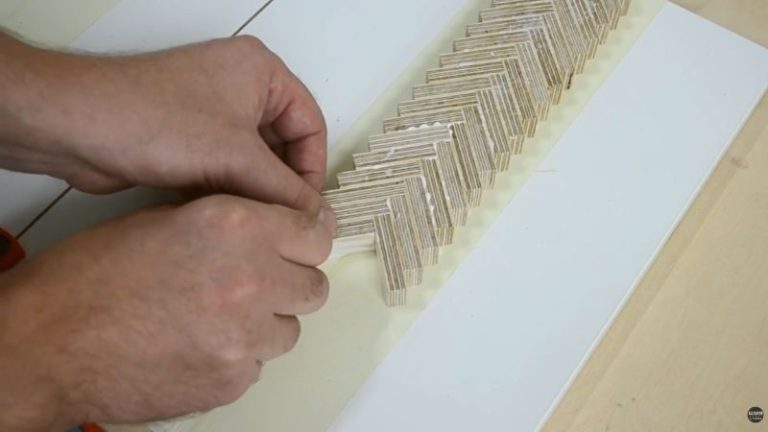 Gluing small Baltic birch plywood blocks into a herringbone pattern to create decorative outer handle panels for a wooden mallet.