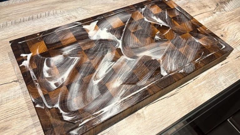 Applying cutting board soap to a walnut end grain cutting board as part of a regular care routine.