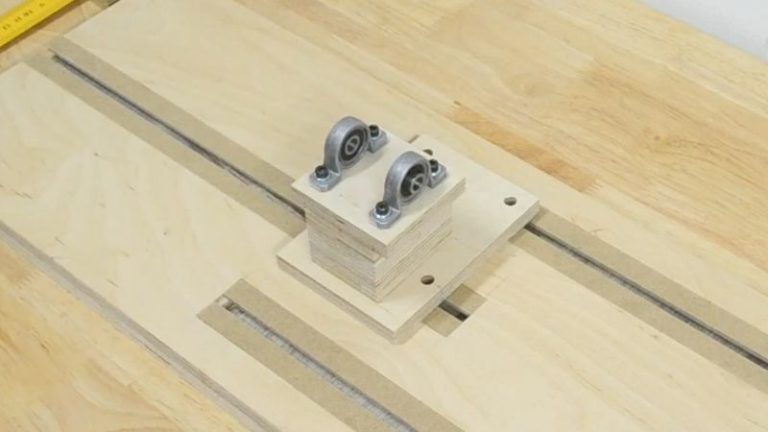Spindle for a DIY drill lathe made from Baltic birch plywood with two 8 mm bearings mounted on top.
