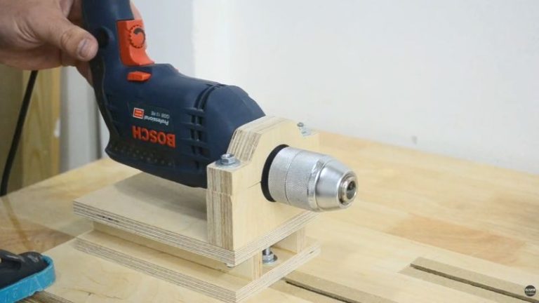 Adjustable drill holder for a DIY drill lathe made from Baltic birch plywood and aligned with the spindle.