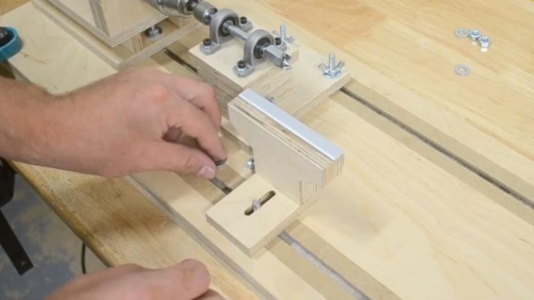 Tool rest made from Baltic birch plywood and aluminum for a homemade drill-powered wood lathe.