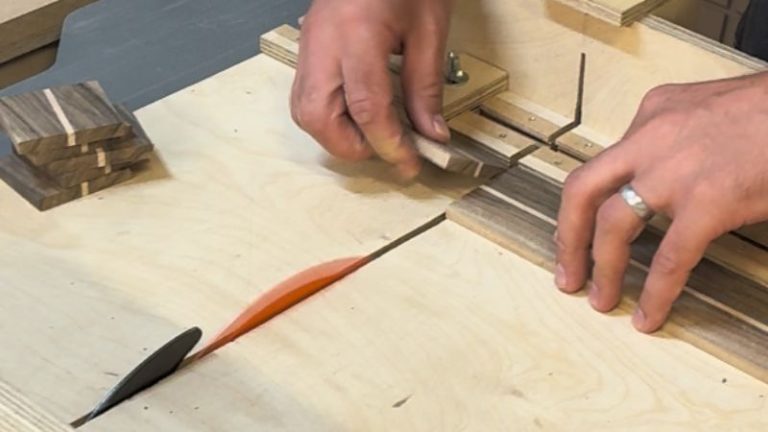 Cutting laminated walnut and beech box sides to length on a table saw sled.