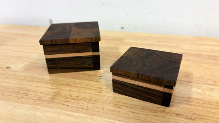 Finished small walnut keepsake boxes with a beech accent stripe and fitted lid.