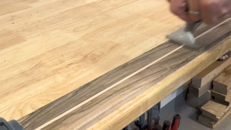 Flattening a thin walnut and beech panel with a router flattening jig.