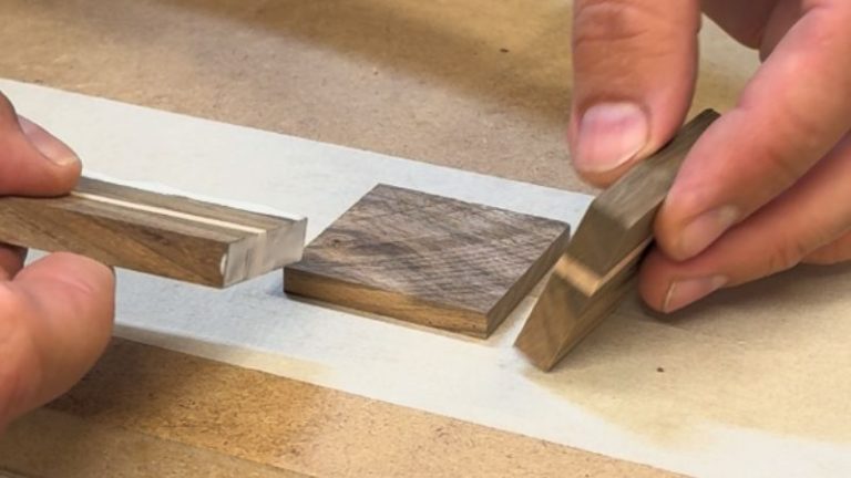 Small walnut and beech keepsake box clamped together during glue-up.