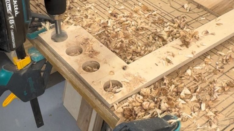 Large clamping holes drilled into a Baltic birch plywood router rabbet jig.