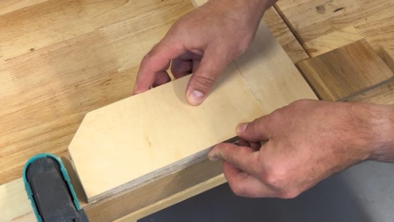 Overlapping plywood clamping section being attached to a router rabbet jig.