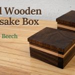 Two small walnut and beech wooden keepsake boxes with fitted lift-off lids.