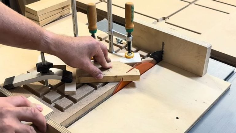 Cutting the inner point of a wooden star piece on a table saw sled