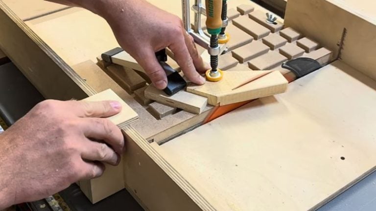 Cutting the outer point of a wooden star piece on a table saw