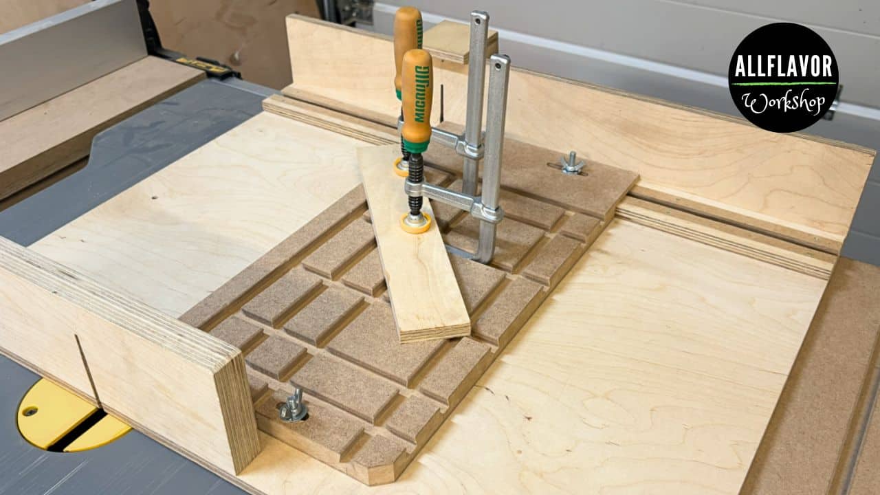 DIY table saw angle jig mounted on a table saw sled with a workpiece clamped at an angle.