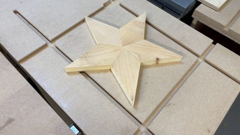 Five spruce pieces arranged to form a 5-point wooden star