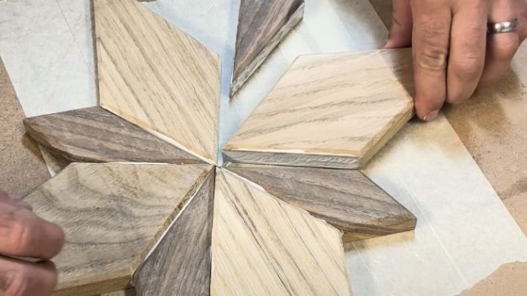 Oak and walnut wooden Bethlehem star being glued together on a flat workbench.