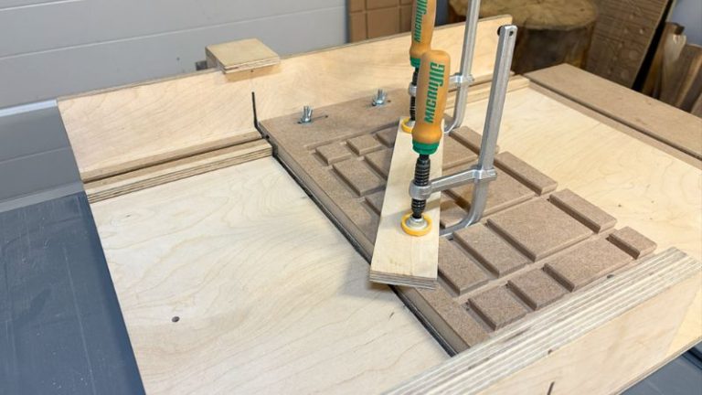 Finished HDF table saw angle jig with horizontal and vertical dovetail clamping slots.