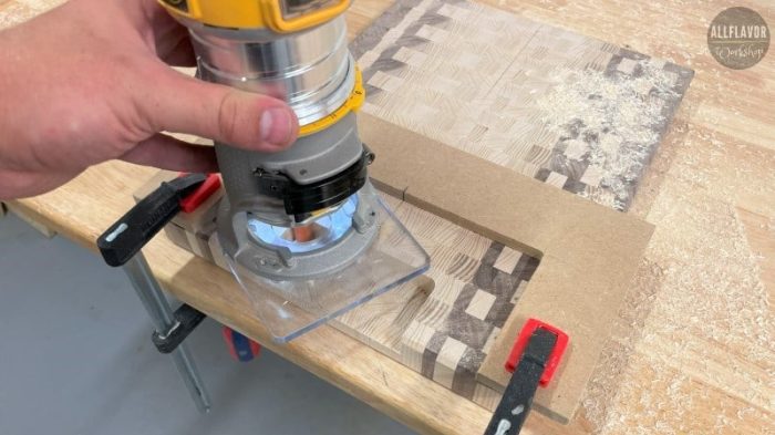 Cutting a handle on a finished cutting board with a jig