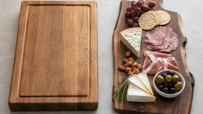 Charcuterie board vs cutting board showing a wooden serving board beside a thicker kitchen cutting board.