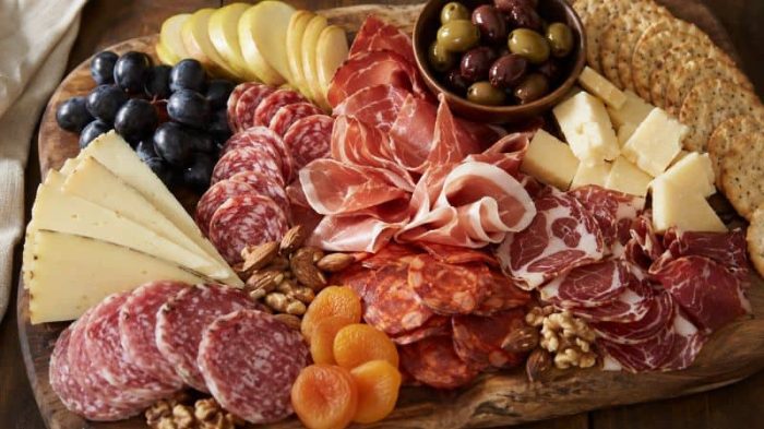 rustic_charcuterie_board_spread Walnut wooden serving board suitable for both cheese and charcuterie.